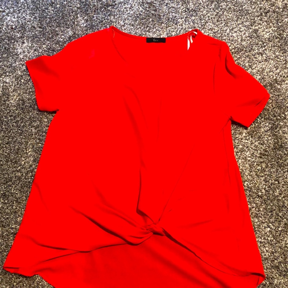 Tua brand. Coral blouse. Knotted top. Polyester. Size large.